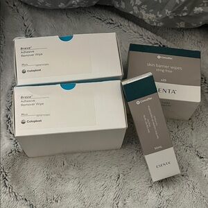 Adhesive remover wipe + barrier spray